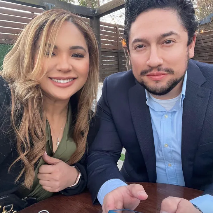 Two Team Legacy agents at an outdoor table